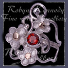 10 Karat Yellow Gold, Sterling Silver and Mozambique Garnet 'Feelin' Groovy' Ring Image