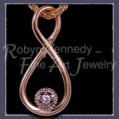 14 Karat Yellow Gold and Diamond 'Eternity' pendant Image