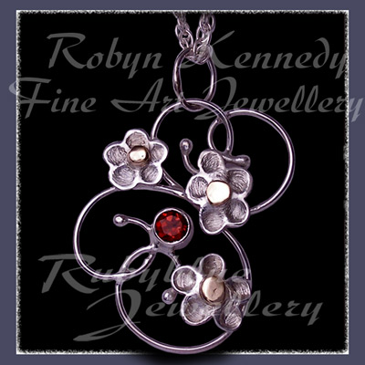 10 Karat Yellow Gold, Sterling Silver & Mozambique Garnet 'Feeling Groovy'  Pendant Image