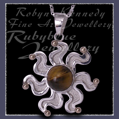 10 Karat Yellow Gold, Sterlling Silver and Tiger's Eye 'Sun' Pendant Image