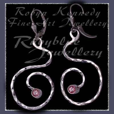 Sterling Silver and Passion Pink Topaz 'Swirls' Earrings Image