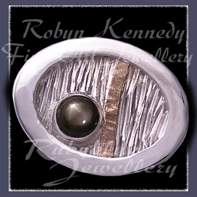 10 Karat Yellow Gold, Sterlium, Sterling Silver and Black Star Sapphire, 'Total Eclipse' Tie Tac Image